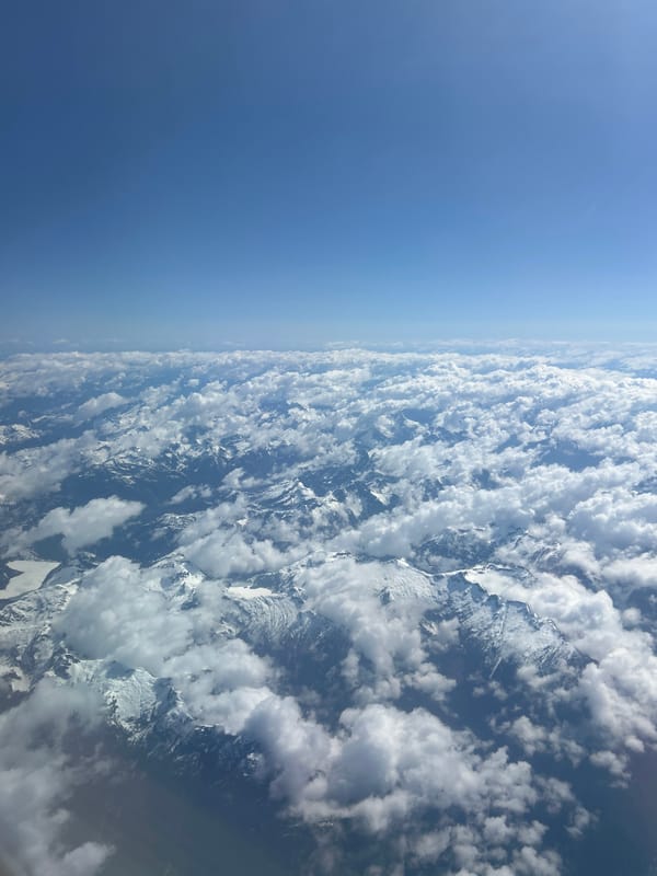 Aerial views capture clouds over Kelowna mountains