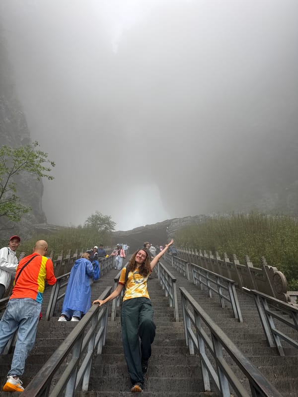 Foggy morning brings tourists to Zhangjiajie mountain trails