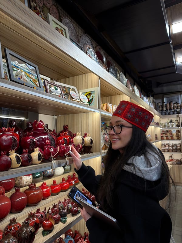 Tattooed visitor shops traditional Armenian crafts at Yerevan market