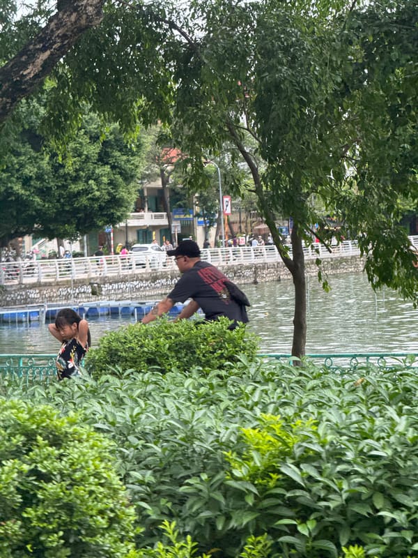 Quiet moment along Hanoi's West Lake on an overcast morning