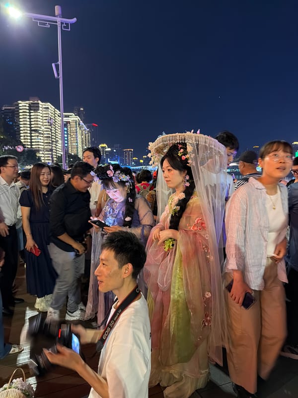 Traditional dress gathering captured on Yuzhong District streets at night