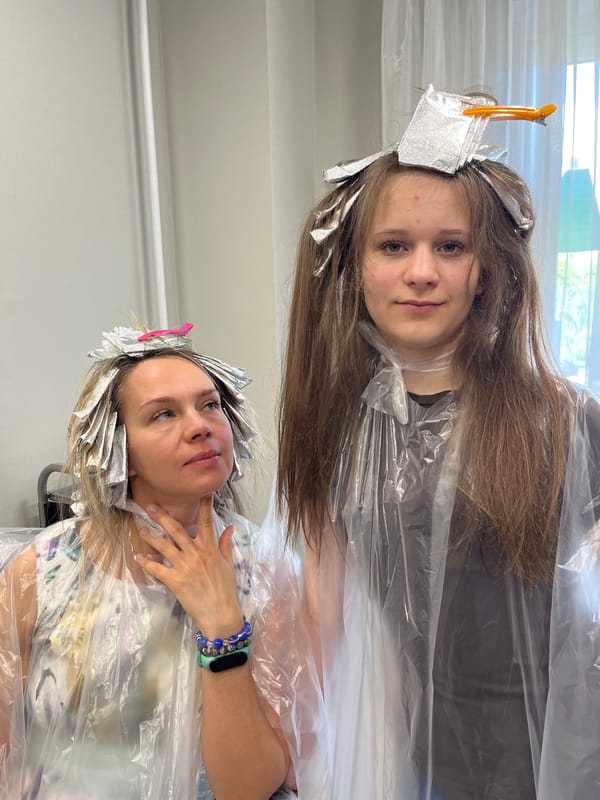 Mother and daughter get hair treatments in Dubovoye, Russia