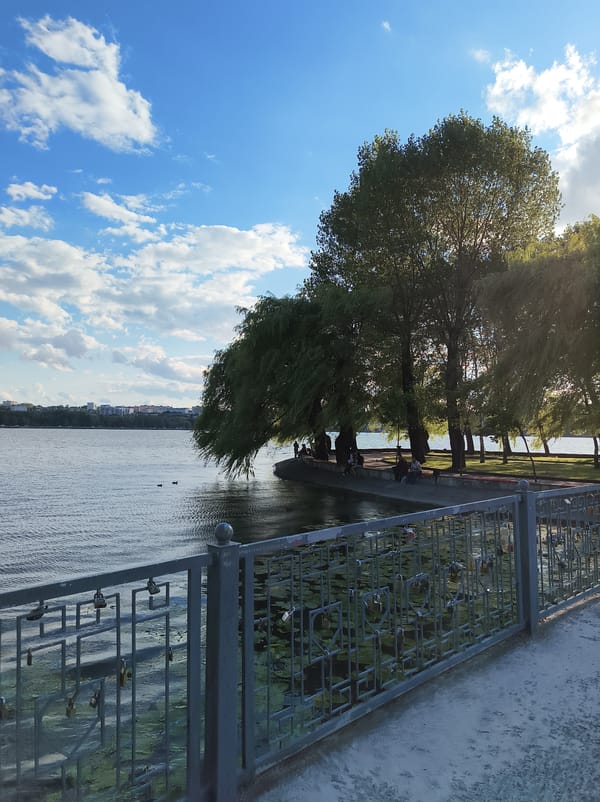 Sunny afternoon along Ternopil Pond's promenade and waterfront