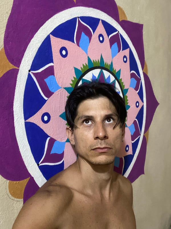 Mural, cat, and a face — a quiet moment in Los Velásquez