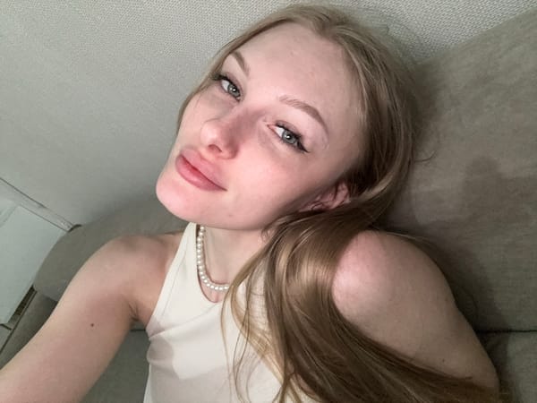 Woman documents selfie session in bedroom, Perm Russia