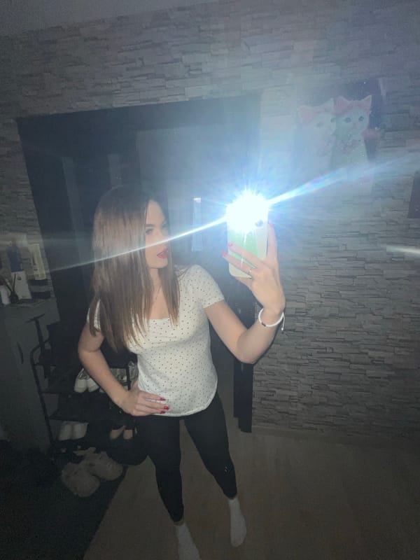 Woman documents casual moments with white cat in Noviy home