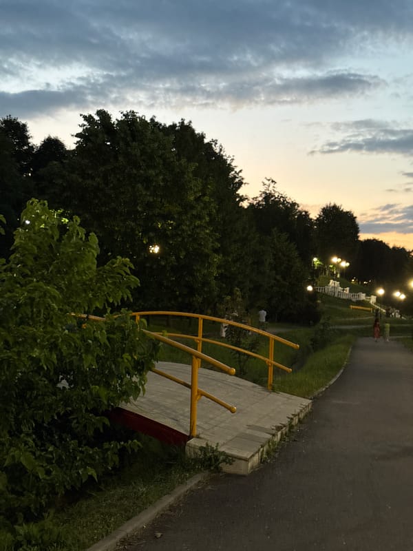 Dusk settles over a Vladikavkaz park at golden hour