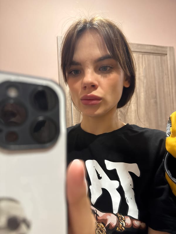 Woman Takes Multiple Selfies Indoors in Anapa, Russia