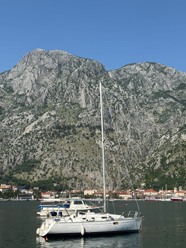 Sailboats dock in Bay of Kotor near Škaljari, Montenegro