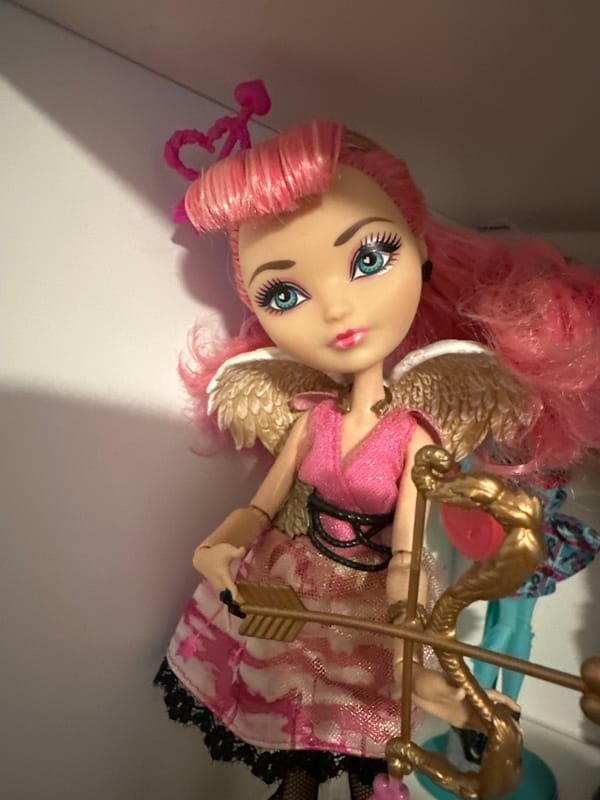 Close-up shots of toys, dolls, figurines, and flowers
