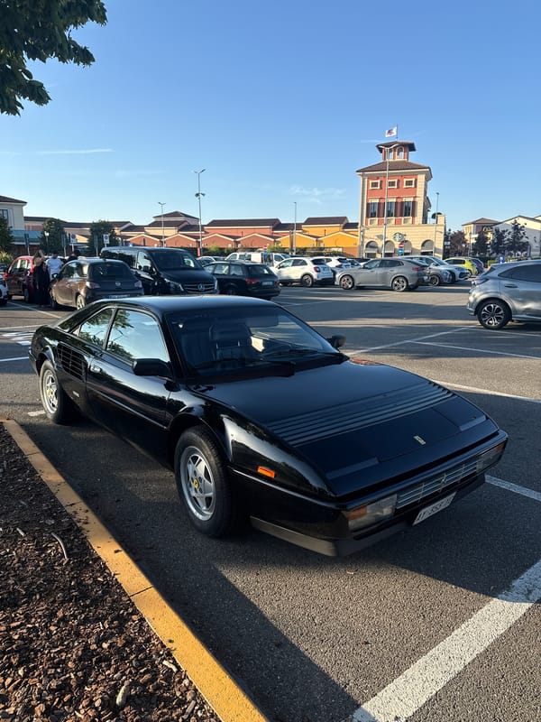 Black Ferrari Mondial T parked in Serravalle Scrivia lot