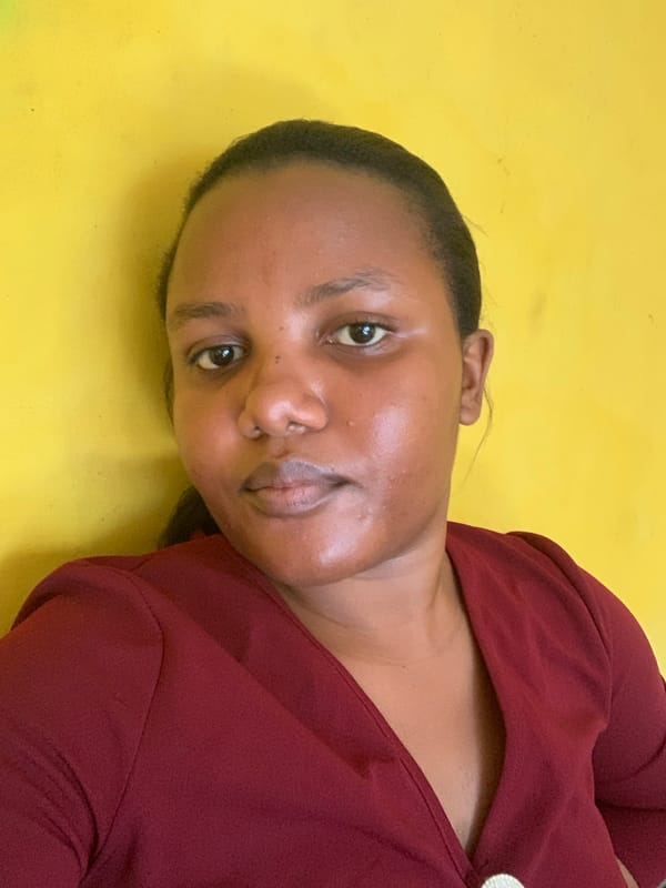 Woman photographed in casual indoor poses in Dar es-Salaam