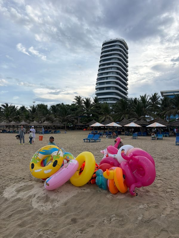 Da Nang beachfront: sand, umbrellas, and coastal streets on a summer morning
