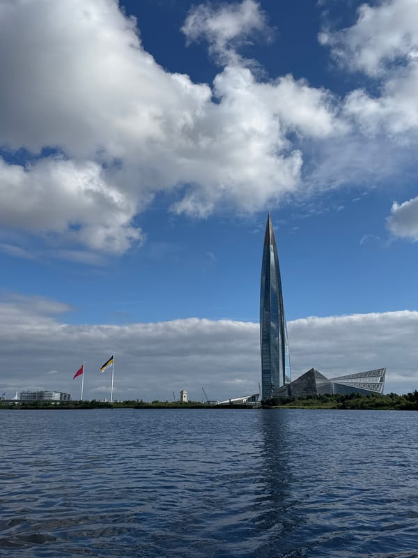 Kayaking past lily pads with Lakhta Center in the distance
