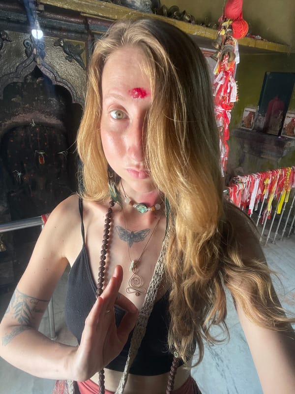 Woman photographs herself at Hindu temple in Nepal
