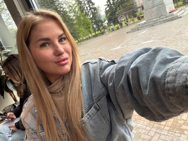 Woman documents coffee shop visit in Gorno-Altaysk, Russia
