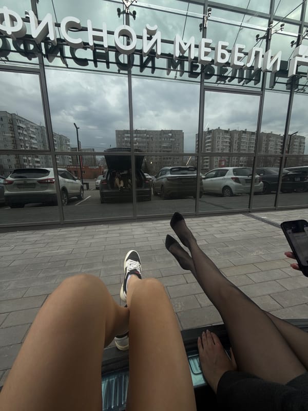 Street-level photography captures two people in Krasnoyarsk