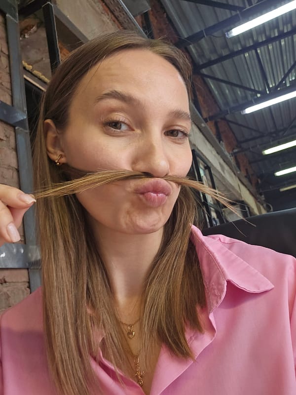 Woman documents morning workday in Chaikovsky office space