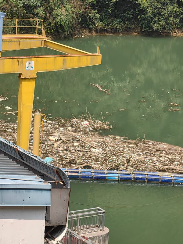 Heavy pollution and submerged excavator documented in Vietnamese river