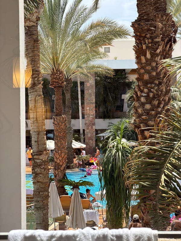 Vacationers enjoy poolside leisure at Eilat resort