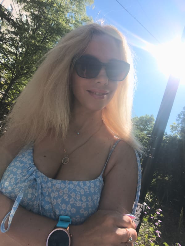 Woman takes morning selfie with white roses in Sevastopol