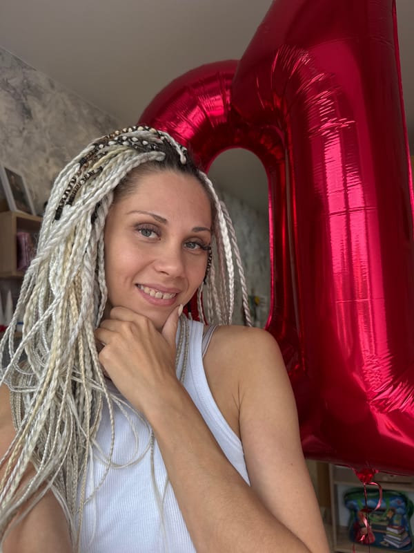 Outdoor birthday celebration with balloon and stroller in Rusanovo