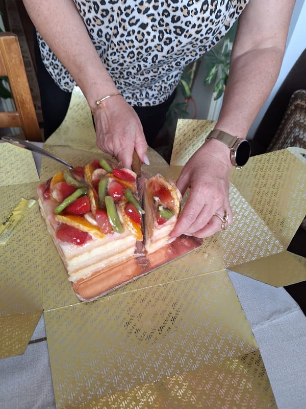 Afternoon fruit tart and coffee shared with small dog