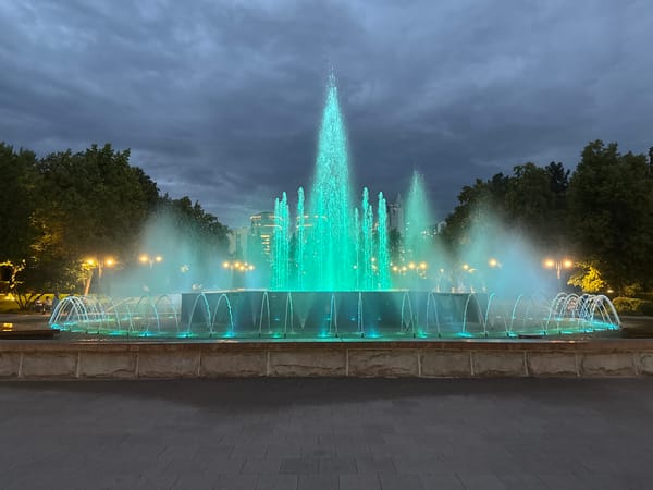 Almaty's Singing Fountain lit up at dusk, June 2026