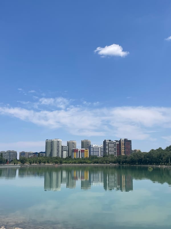 Almaty's lakeside park on a bright summer morning