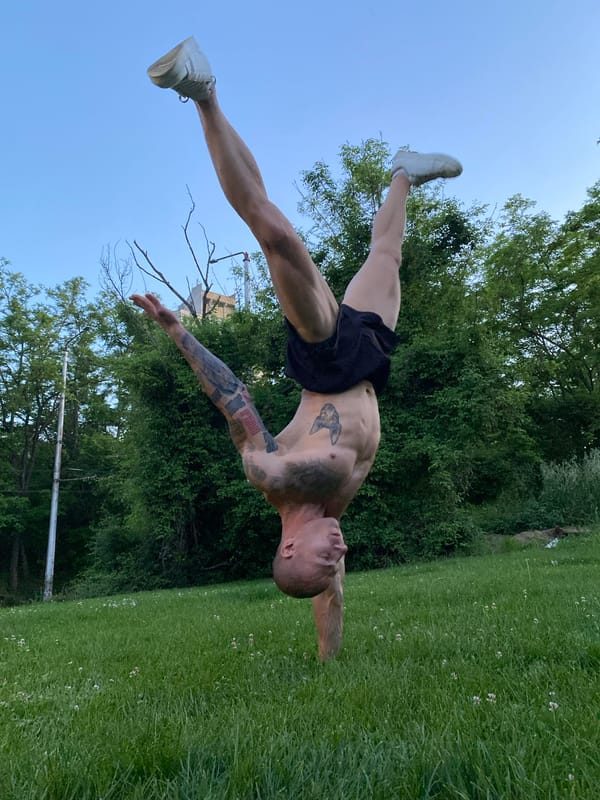 Man performs outdoor calisthenics routine in Pleven park