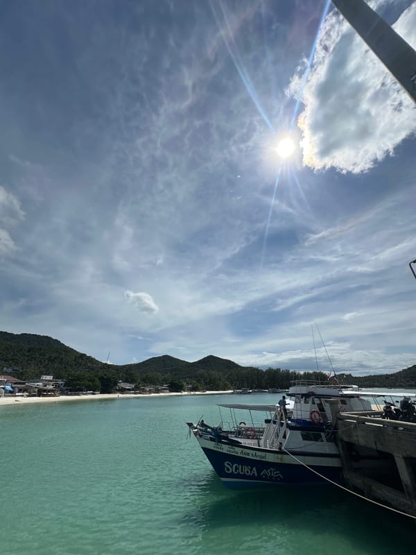 Lazy morning at Koh Phangan's harbor, pier, and beachside cafés