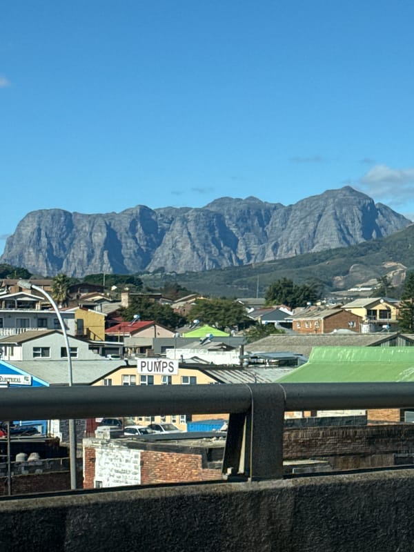 Clear day view of Cloetesville beneath mountain range