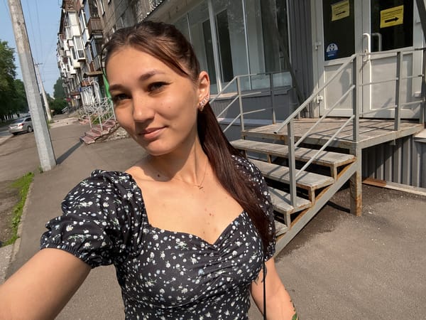 Sunny selfie session on a Novokuznetsk sidewalk
