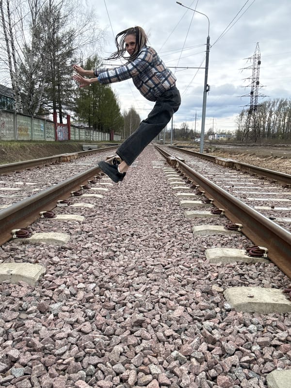 Person poses on railway tracks, takes transport selfies in Russia