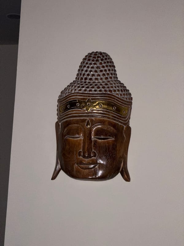 Decorative Buddha sculpture observed on wall in Kalibukbuk, Indonesia