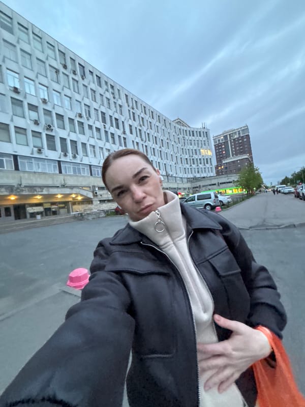 Person documents evening city walk with selfies and street scenes