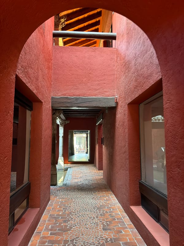 Visitor documents architectural details during afternoon stroll in Puebla