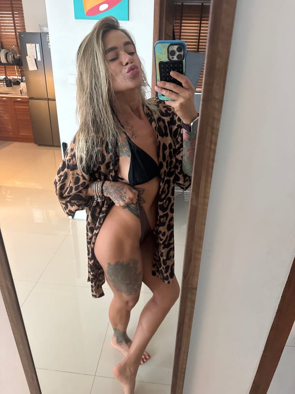 Woman takes mirror selfies in leopard print in Thailand
