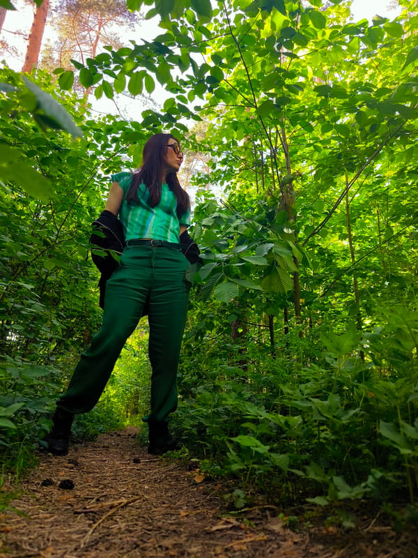 Woman in green outfit spotted in Riga forest clearing