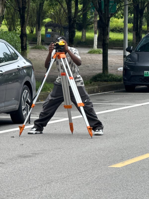 Survey crews and scooter traffic fill Jiangjin streets on a June morning