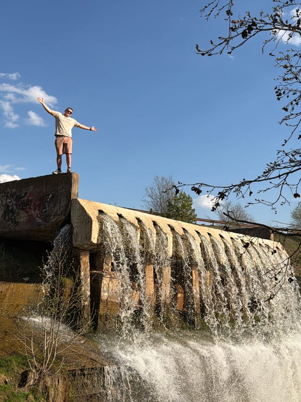 Man visits concrete waterfall structure in Kamennoye, Russia