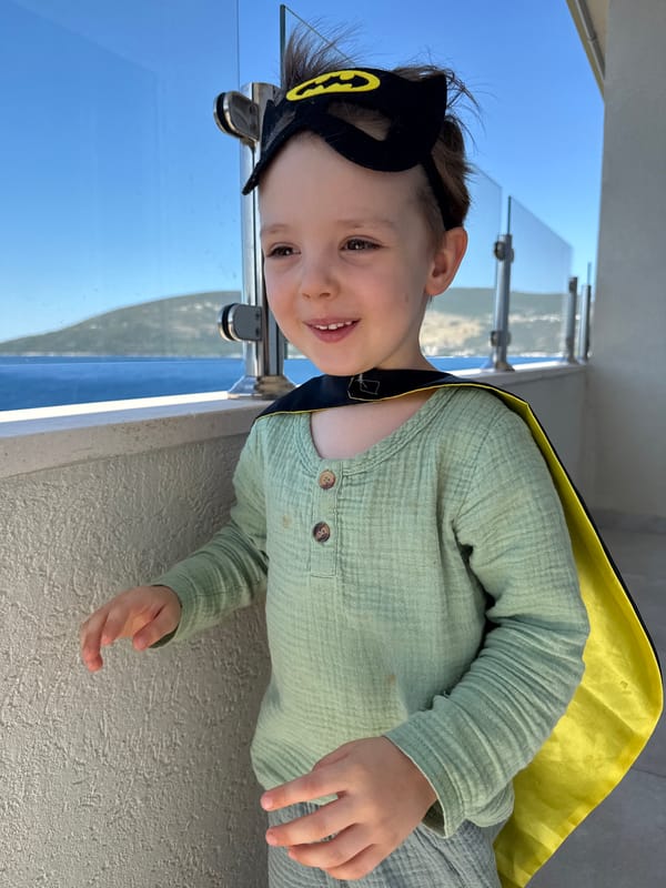 Batman costume on a Herceg Novi balcony above the Bay of Kotor