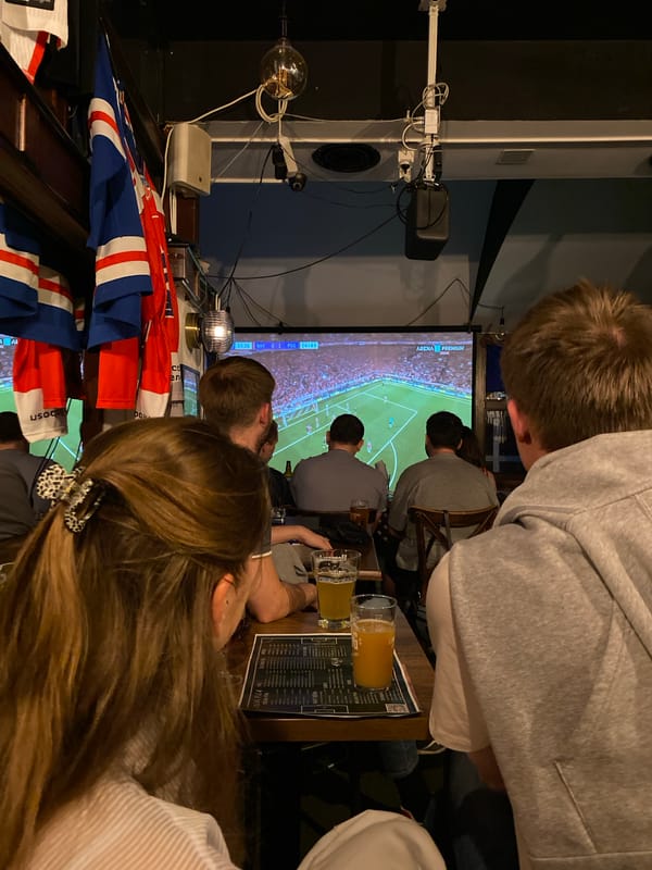 Two women at Novi Sad bar during soccer match