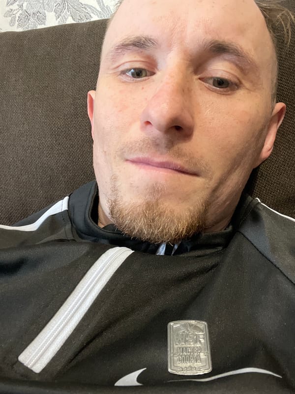 Man resting on couch captured in Sarapul indoor footage