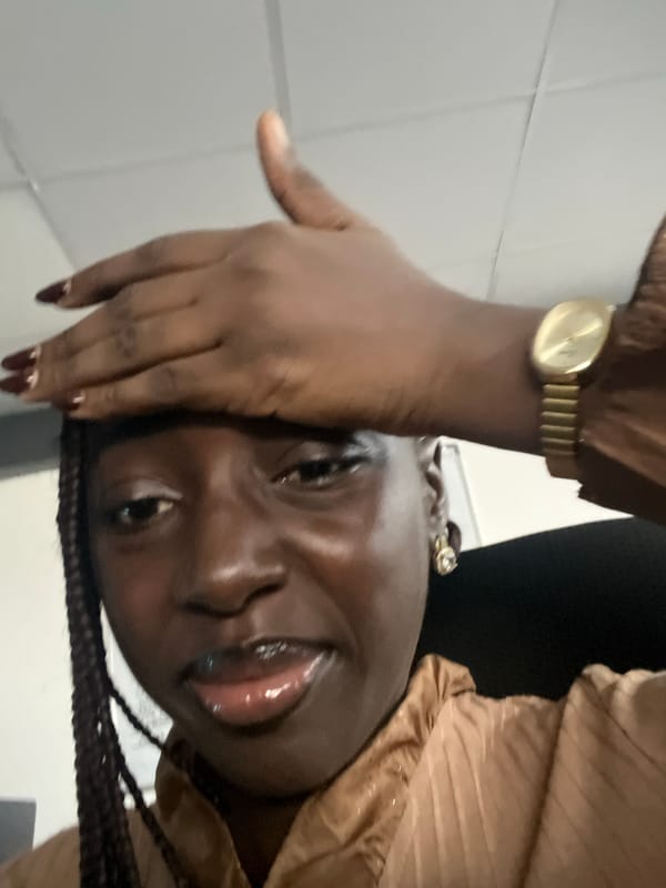 Woman takes selfie in office setting in Karum, Nigeria