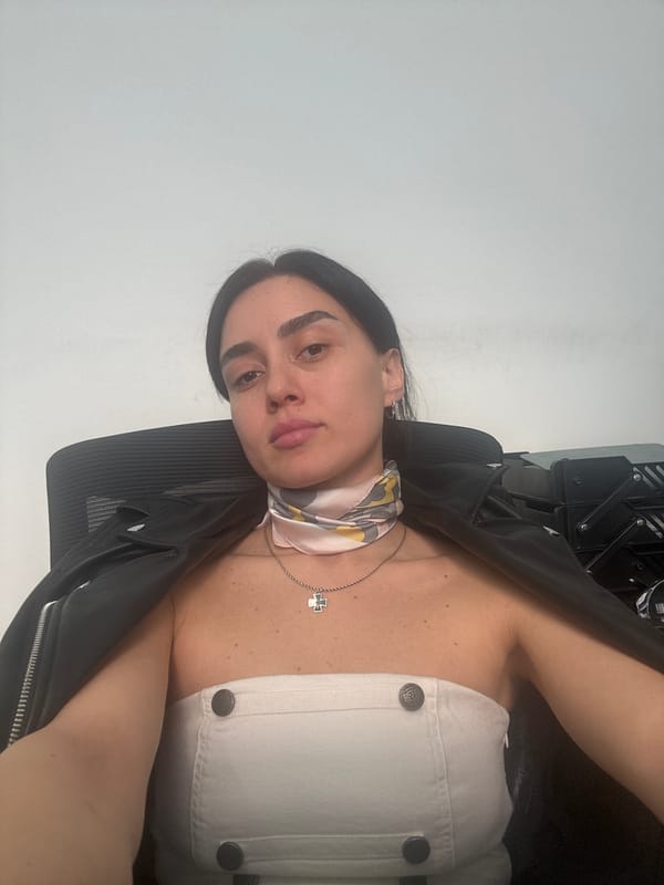 Woman photographed in office setting in Tbilisi