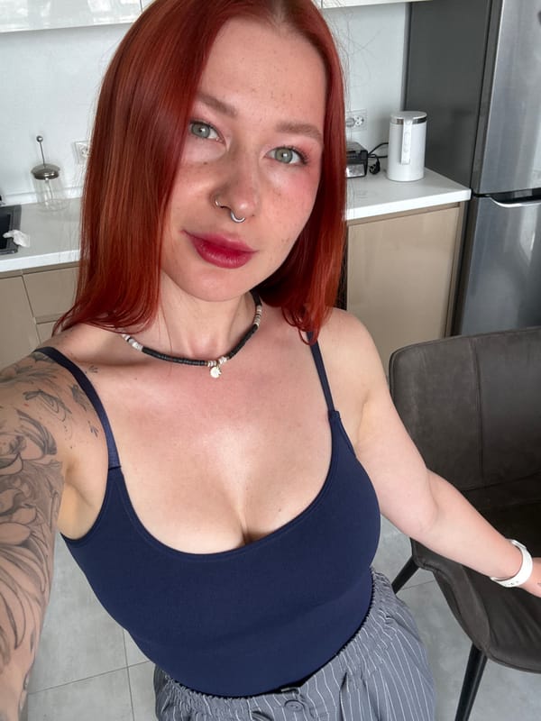 Red-haired woman relaxes on couch in Rostov-on-Don