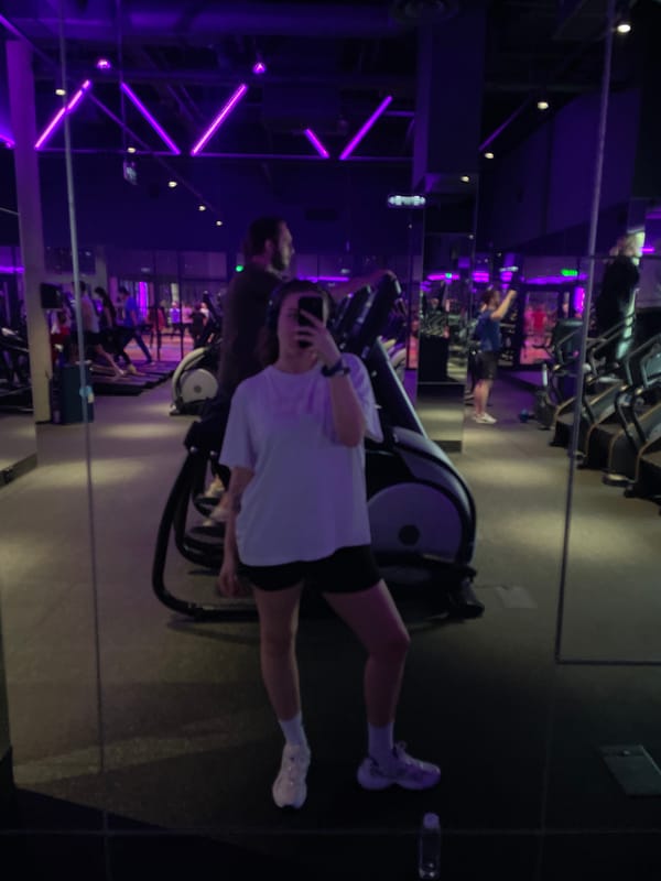 Gym selfies captured at purple-lit Moscow fitness center