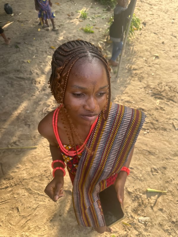 Traditional dress and social moments in a Badagry courtyard