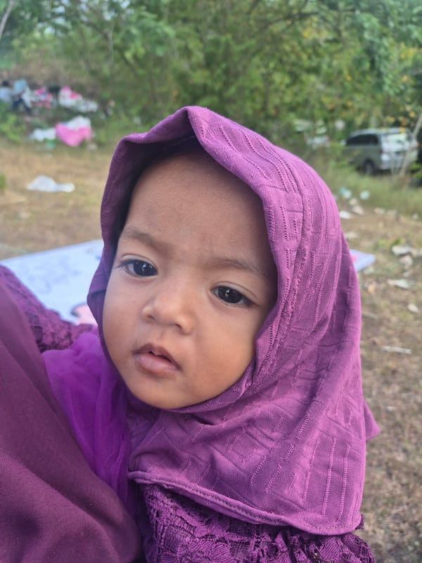 Children photographed in casual moments in Lhokseumawe, Indonesia